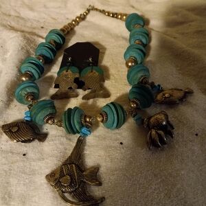Used,not new very chunky 24 in necklace& 4 hanging  fish& matching  earrings.